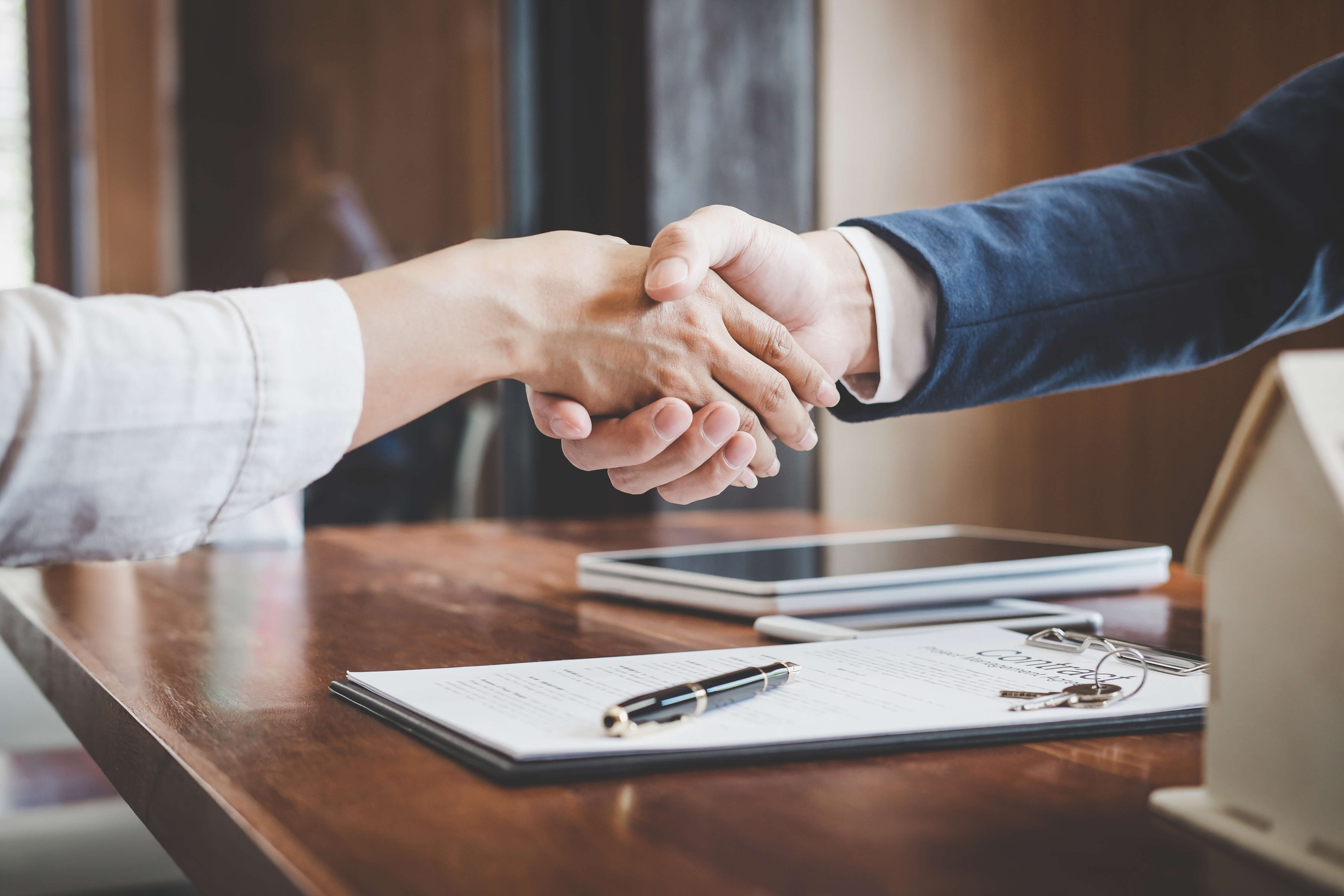 Personal Injury attorney shaking hands with client