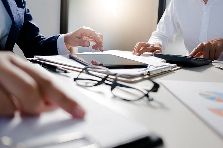 Business' paperwork on a table for a company