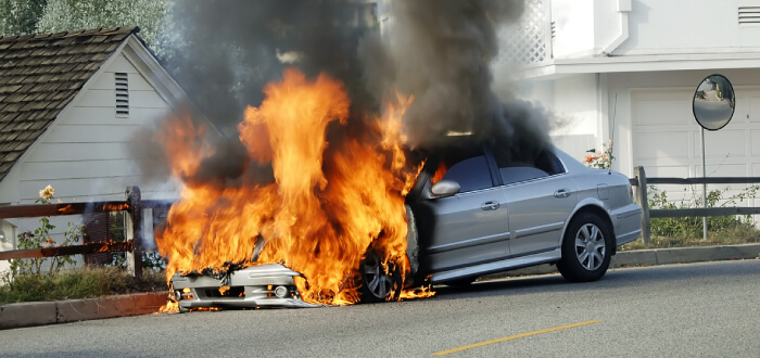 A car explodes and goes on fire